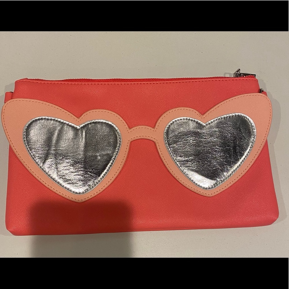 Can’t Clutch This peach heart sunglasses clutch. NWOT